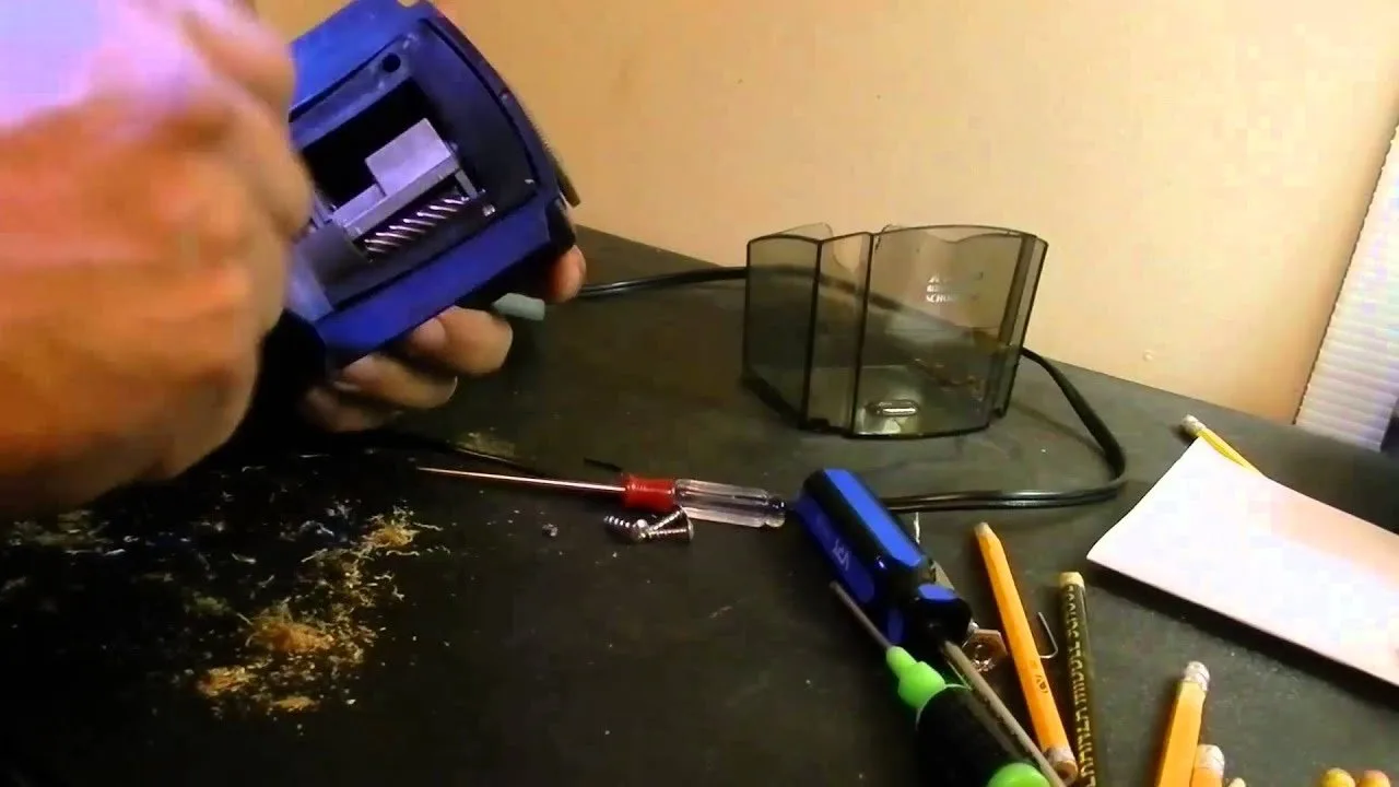 Small wood shards and lead fragments stuck in pencil sharpener blades.