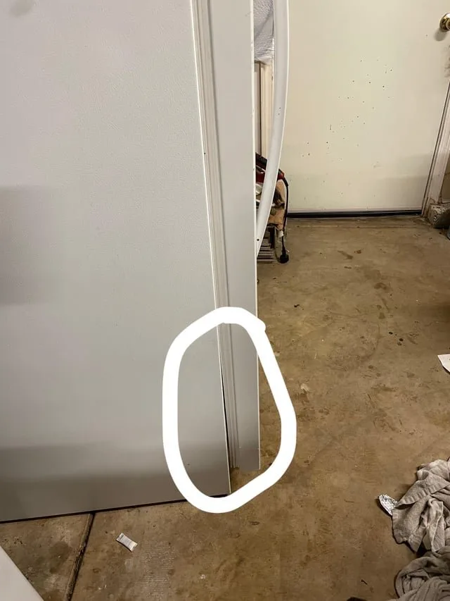 Replacing a damaged rubber freezer door seal to restore a proper airtight fit.