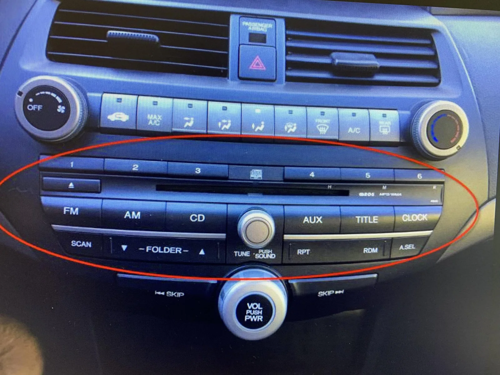 A faulty car stereo unit removed from a dashboard for internal hardware inspection.