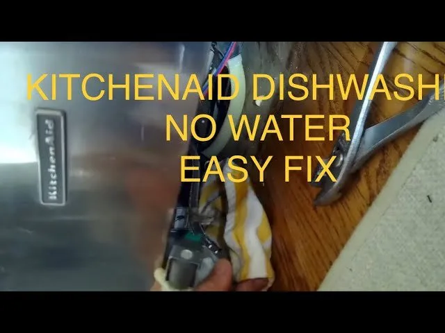 Cleaning a dishwasher filter under running water to ensure proper water flow.