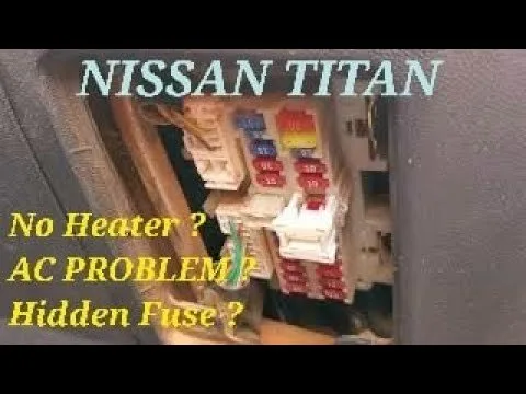 The dashboard and center console area of a Nissan Titan truck interior.