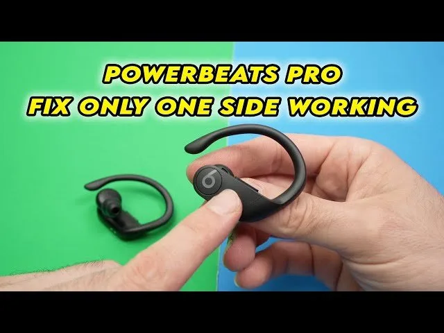 Close-up view of the gold charging contacts on a wireless earbud.