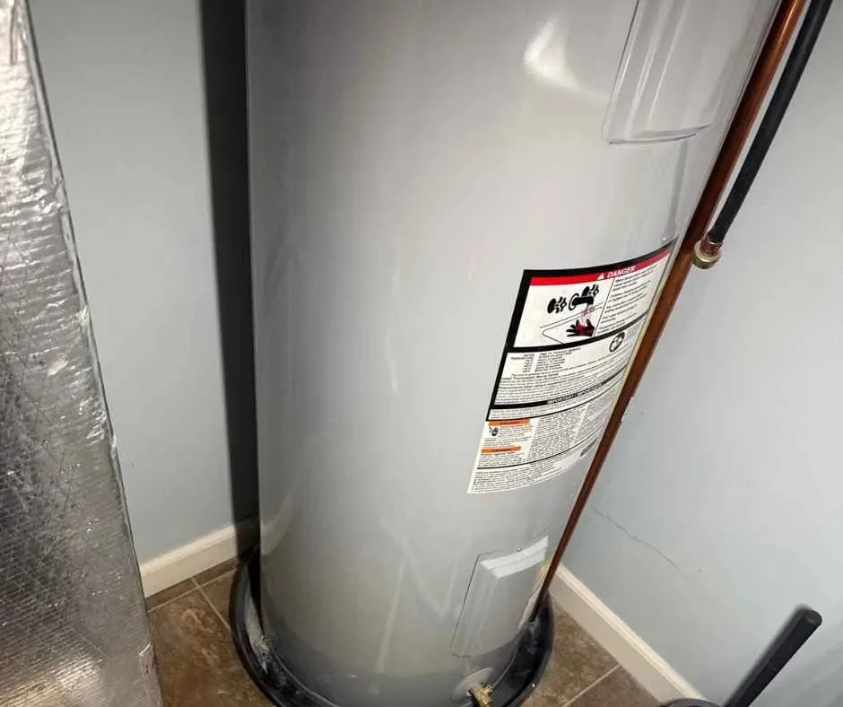 Replacing a small battery in a home leak detector device.