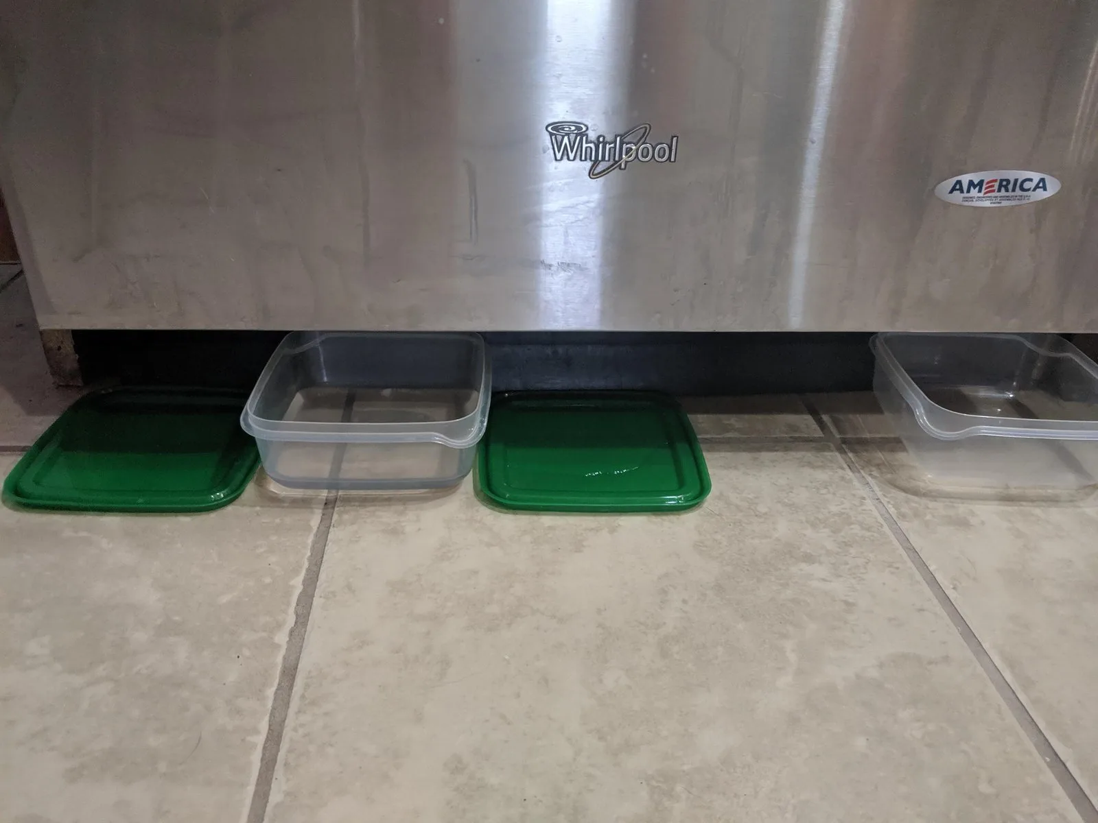 A tablet showing dishwasher troubleshooting tips placed on a modern kitchen counter.
